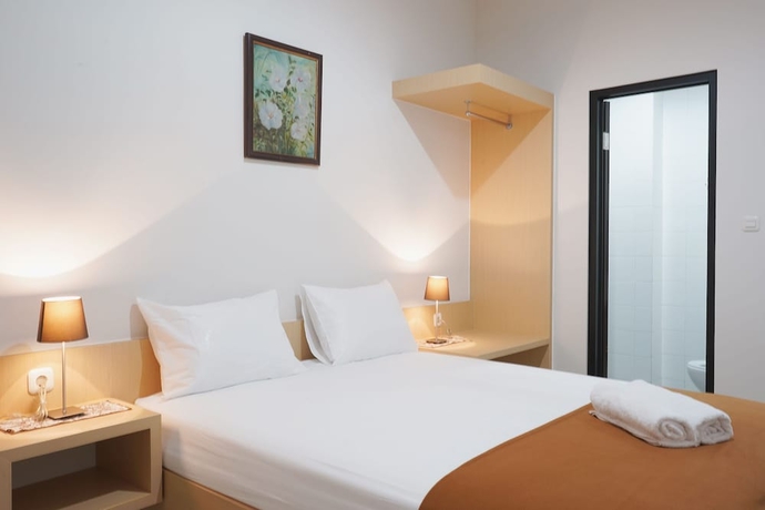 Imagen de la habitación del Hotel UROOMS Panglima Polim. Foto 5