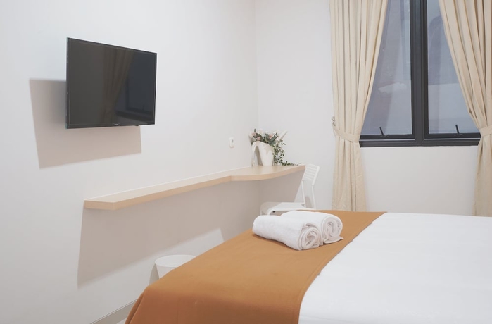 Imagen de la habitación del Hotel UROOMS Panglima Polim. Foto 6