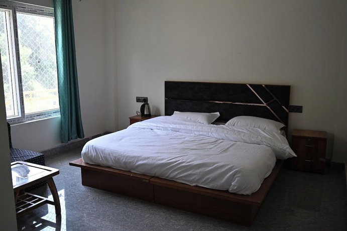 Imagen de la habitación del Hotel Uday Villa. Foto 13