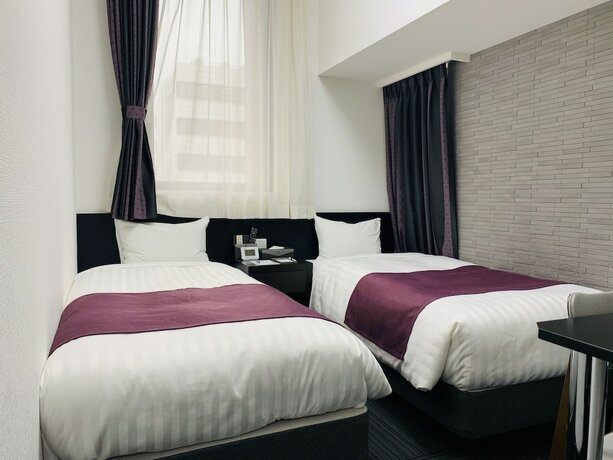 Imagen de la habitación del Hotel Ueno Urban. Foto 17