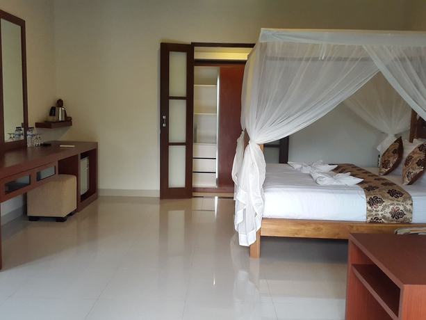 Imagen de la habitación del Hotel Uluwatu Cottages. Foto 12