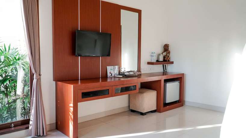 Imagen de la habitación del Hotel Uluwatu Cottages. Foto 14