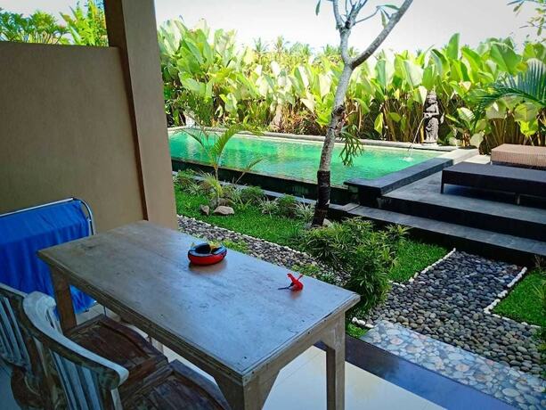 Imagen de la habitación del Hotel Uma Kutuh 2. Foto 14