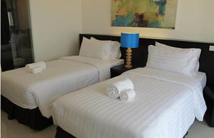 Imagen de la habitación del Hotel Uma Residence. Foto 11