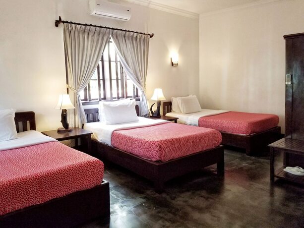 Imagen de la habitación del Hotel Uncle Sam Villa. Foto 22