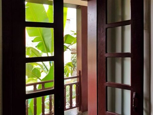 Imagen de la habitación del Hotel Uncle Sam Villa. Foto 26