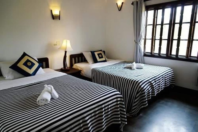 Imagen de la habitación del Hotel Uncle Sam Villa. Foto 28