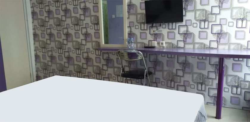 Imagen de la habitación del Hotel Ungu Cirebon. Foto 8