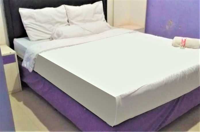 Imagen de la habitación del Hotel Ungu Cirebon. Foto 16