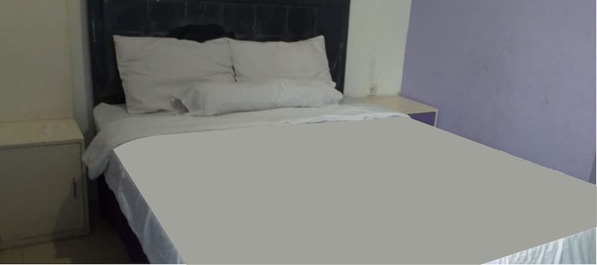 Imagen de la habitación del Hotel Ungu Cirebon. Foto 18