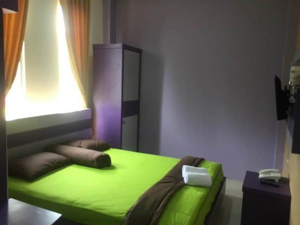 Imagen de la habitación del Hotel Ungu Pas Kangen Bekasi. Foto 8