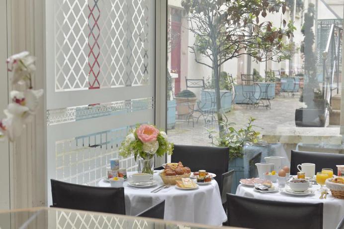 Imagen del bar/restaurante del Hotel Unic Renoir Saint Germain. Foto 1
