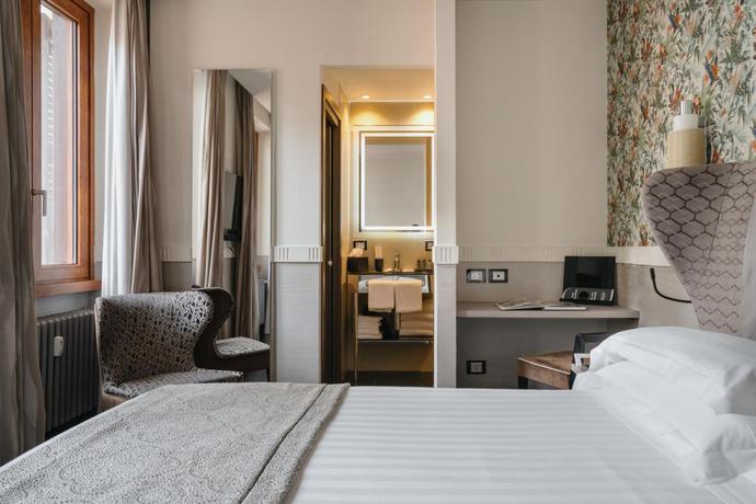 Imagen de la habitación del Hotel Unica Suites Rome. Foto 4
