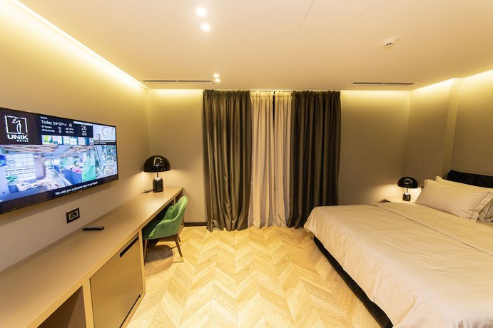 Imagen de la habitación del Hotel Unik, Tirana. Foto 2