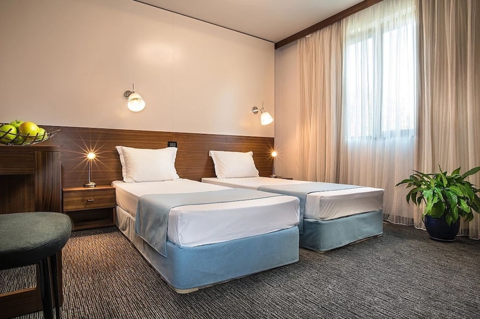 Imagen de la habitación del Hotel Uniqato. Foto 16