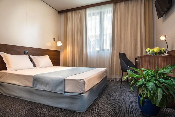 Imagen de la habitación del Hotel Uniqato. Foto 17