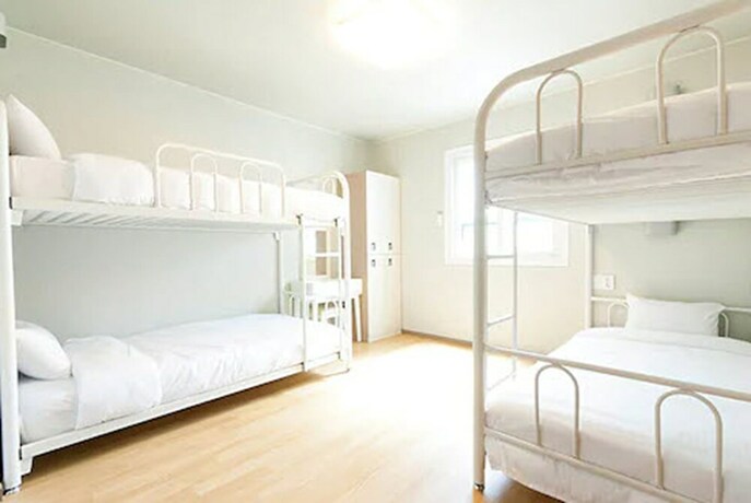 Imagen de la habitación del Hotel Uniqstay. Foto 18