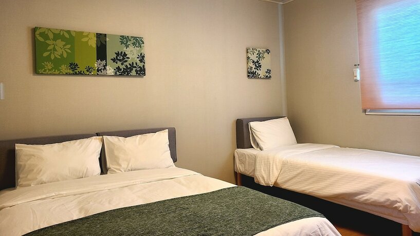 Imagen de la habitación del Hotel Uniqstay. Foto 20