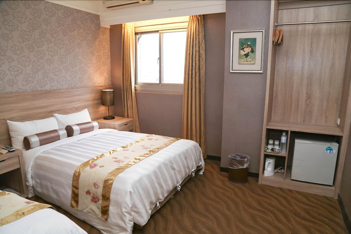 Imagen de la habitación del Hotel Unique Holiday. Foto 6