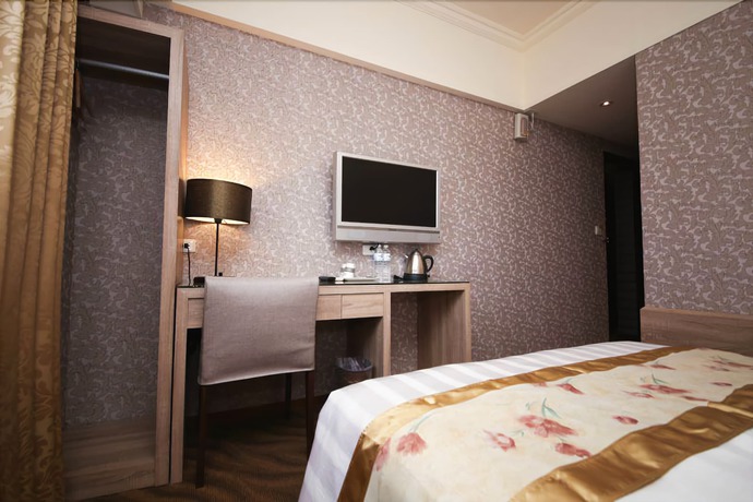 Imagen de la habitación del Hotel Unique Holiday. Foto 9