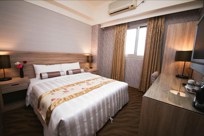 Imagen de la habitación del Hotel Unique Holiday. Foto 15