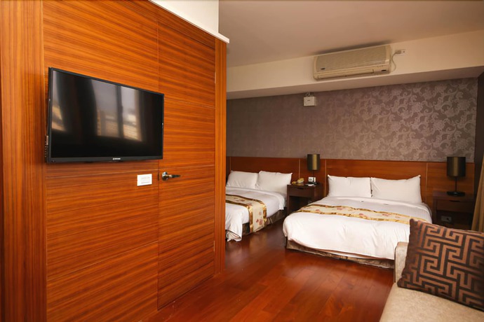 Imagen de la habitación del Hotel Unique Holiday. Foto 16