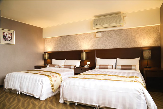 Imagen de la habitación del Hotel Unique Holiday. Foto 17