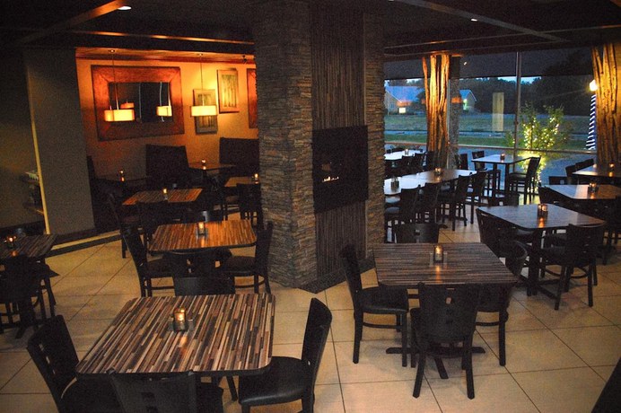 Imagen del bar/restaurante del Hotel Unique Suites. Foto 6