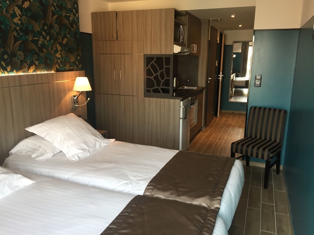 Imagen de la habitación del Hotel Unique and Residence. Foto 8