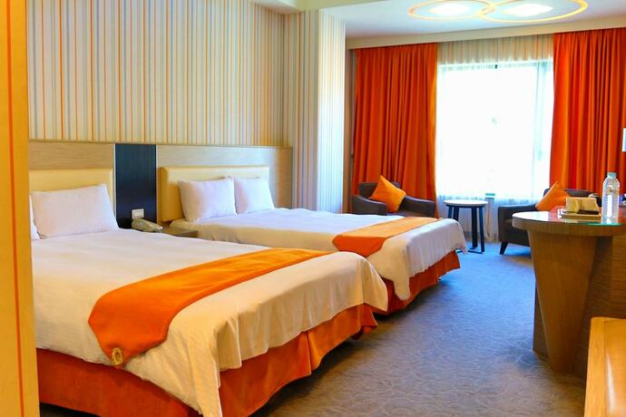 Imagen de la habitación del Hotel Uni-resort Mawutu. Foto 18