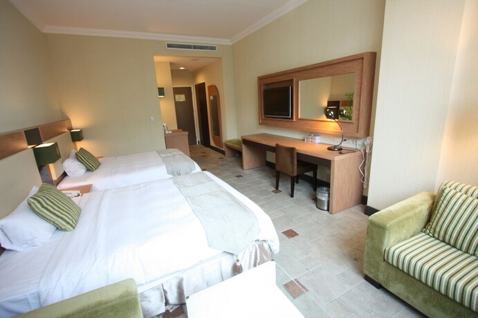 Imagen de la habitación del Hotel Uni-resort Mawutu. Foto 25