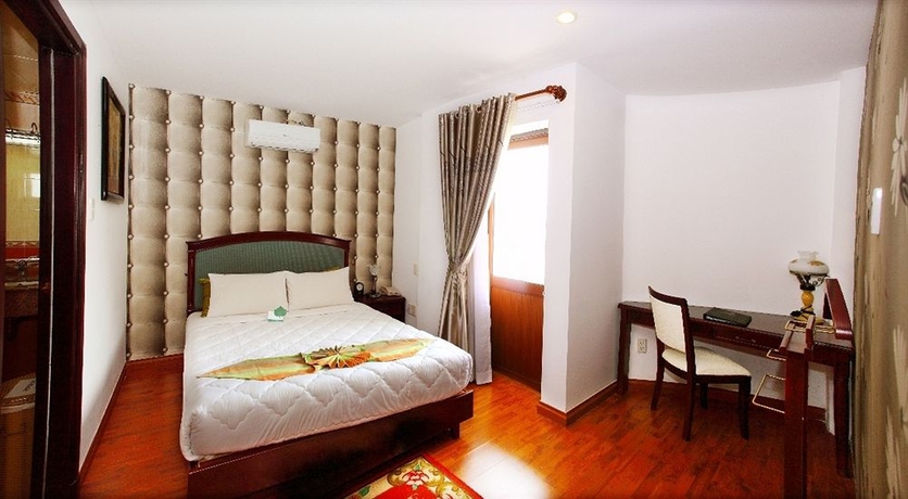 Imagen de la habitación del Hotel Universe Central Hotel Saigon. Foto 4