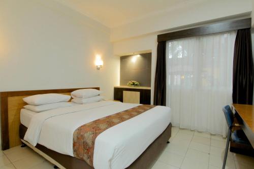 Imagen de la habitación del Hotel University Yogyakarta. Foto 16