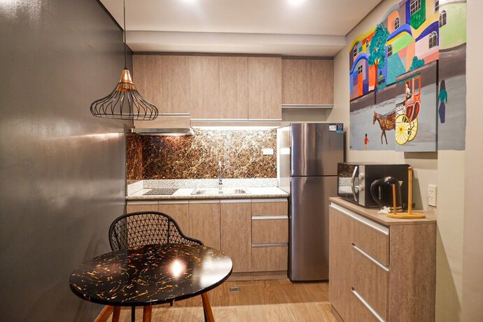 Imagen de la habitación del Hotel Unwnd Flats Makati. Foto 10