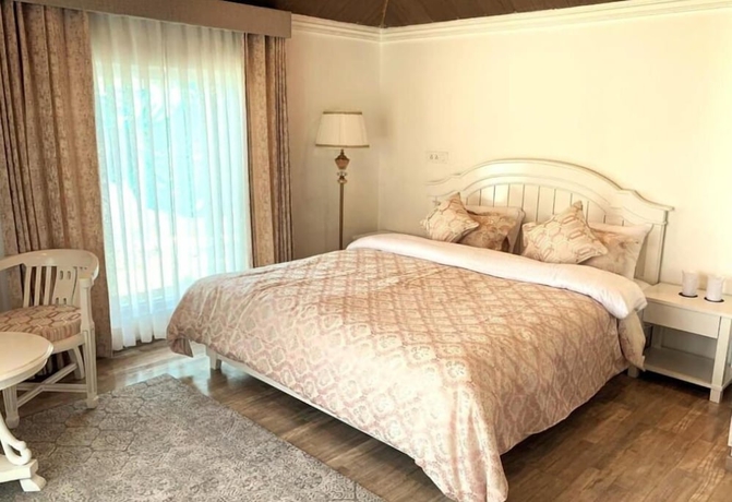 Imagen de la habitación del Hotel Upani Cottages. Foto 7