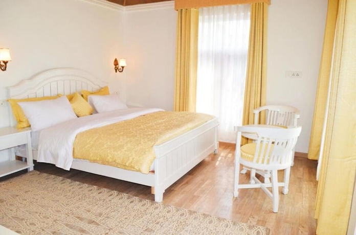 Imagen de la habitación del Hotel Upani Cottages. Foto 8