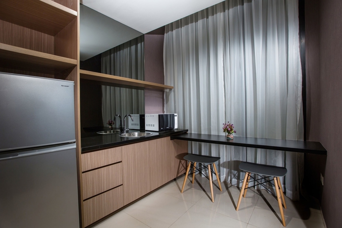 Imagen de la habitación del Hotel Upscale Suites. Foto 7