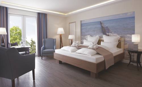 Imagen de la habitación del Hotel Upstalsboomresidenz & SPA K&uuml;hlungsborn. Foto 10