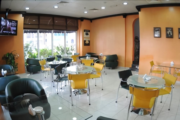 Imagen del bar/restaurante del Hotel Uptown Apartments Abu Dhabi. Foto 8