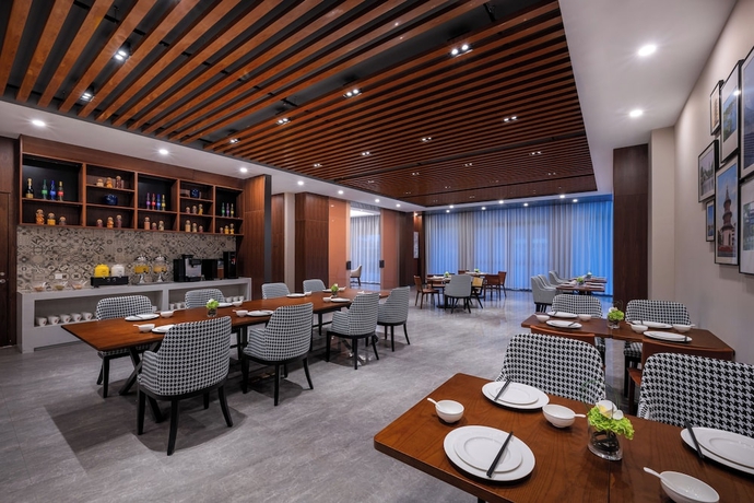 Imagen del bar/restaurante del Hotel UrCove By Hyatt Yangzhou Dongguan Street. Foto 4