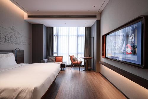 Imagen de la habitación del Hotel UrCove Shantou Yifei Zhugang New City Branch. Foto 18