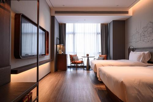 Imagen de la habitación del Hotel UrCove Shantou Yifei Zhugang New City Branch. Foto 19