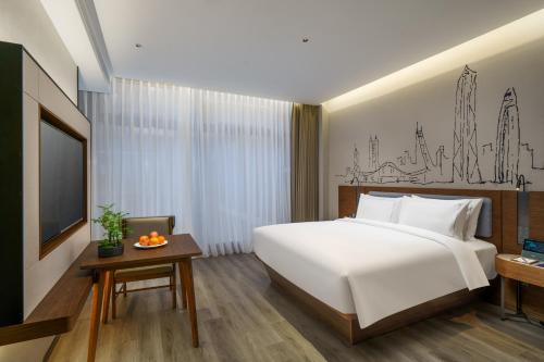 Imagen de la habitación del Hotel UrCove by HYATT Futian CBD. Foto 4