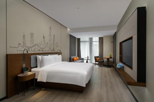 Imagen de la habitación del Hotel UrCove by HYATT Futian CBD. Foto 11
