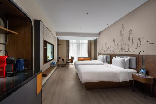 Imagen de la habitación del Hotel UrCove by HYATT Futian CBD. Foto 12