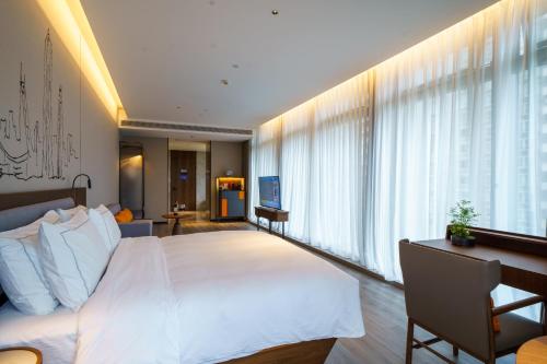 Imagen de la habitación del Hotel UrCove by HYATT Futian CBD. Foto 17