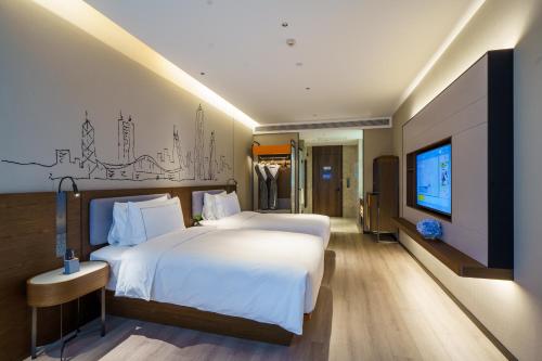 Imagen de la habitación del Hotel UrCove by HYATT Futian CBD. Foto 20