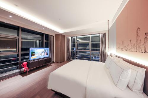Imagen de la habitación del Hotel UrCove by HYATT Shenzhen Luohu. Foto 17