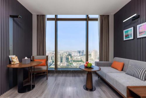 Imagen de la habitación del Hotel UrCove by Hyatt Foshan Downtown. Foto 11