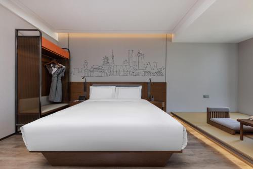 Imagen de la habitación del Hotel UrCove by Hyatt Foshan Downtown. Foto 13